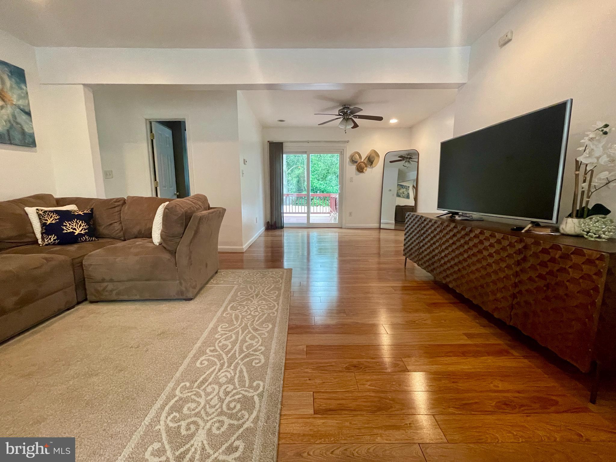 39 Mabel Street Ewing, NJ 08638 - Photo 9 of 33 a living room with furniture and a flat screen tv