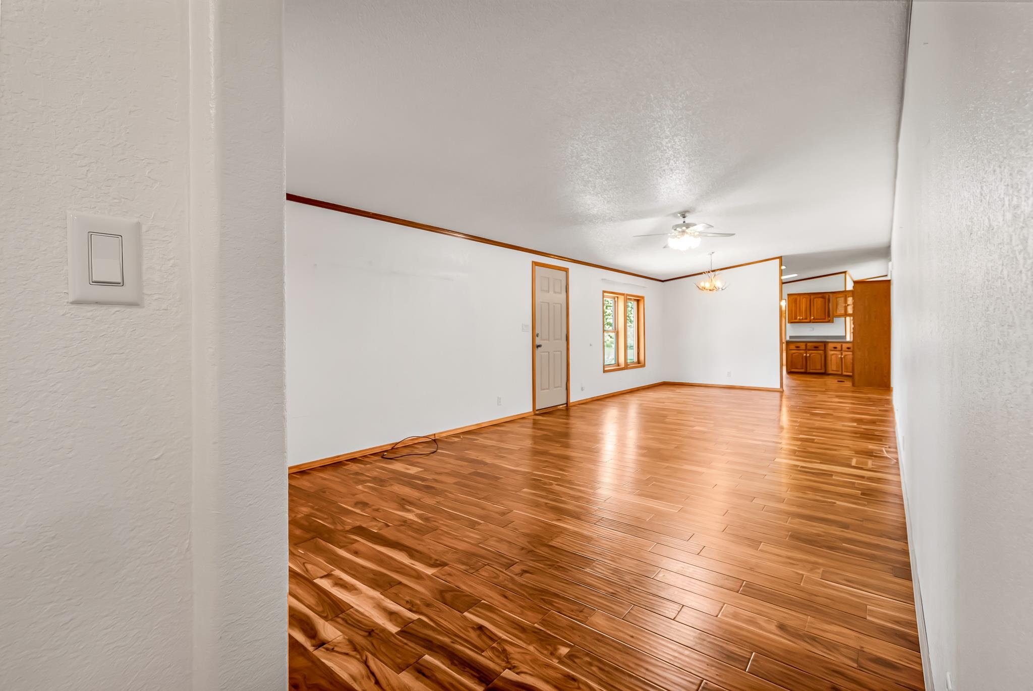 24591 Highway 64 Rangely, CO 81648 - Photo 13 of 42 a view of empty room with wooden floor