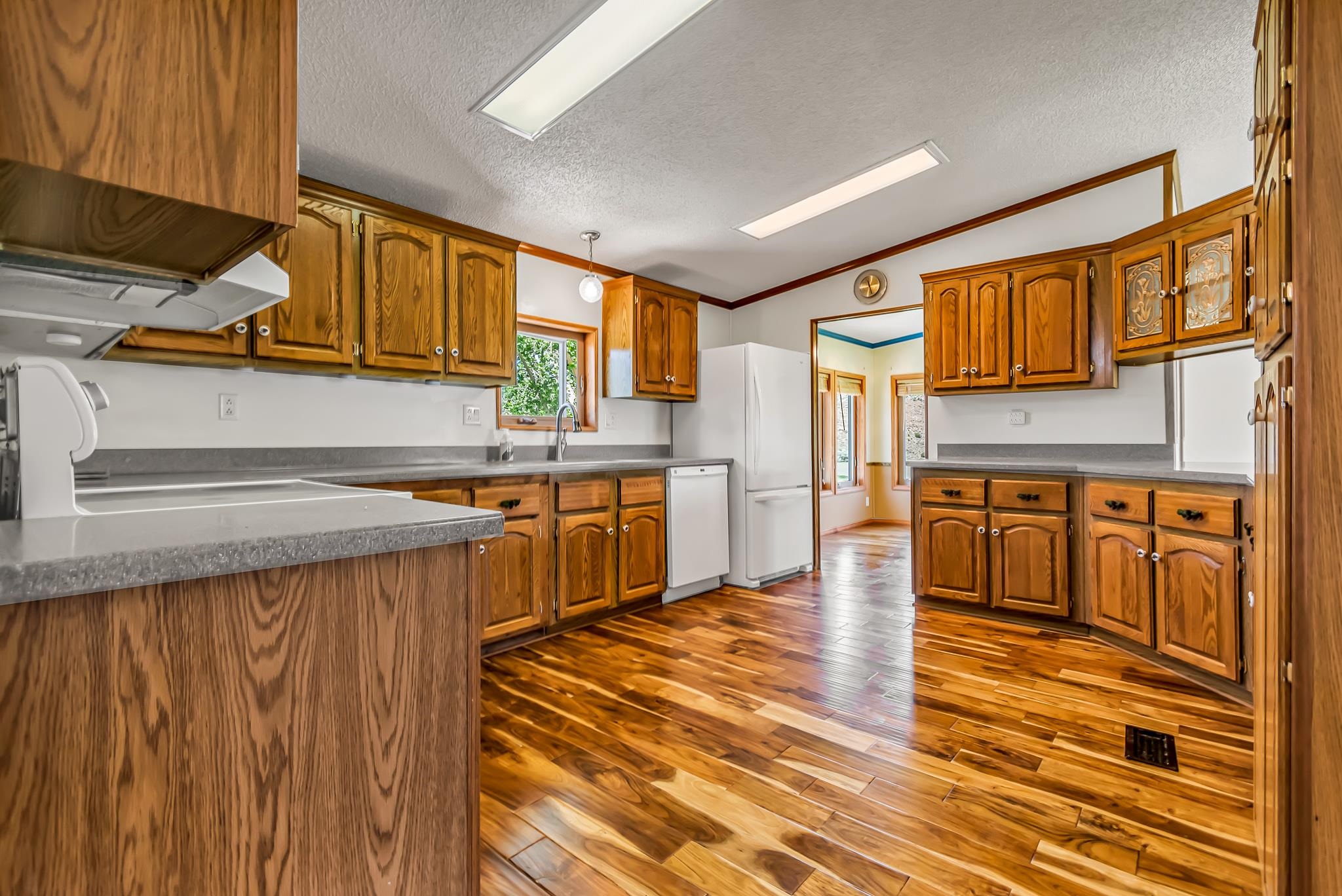24591 Highway 64 Rangely, CO 81648 - Photo 20 of 42 a kitchen with stainless steel appliances granite countertop a sink and cabinets