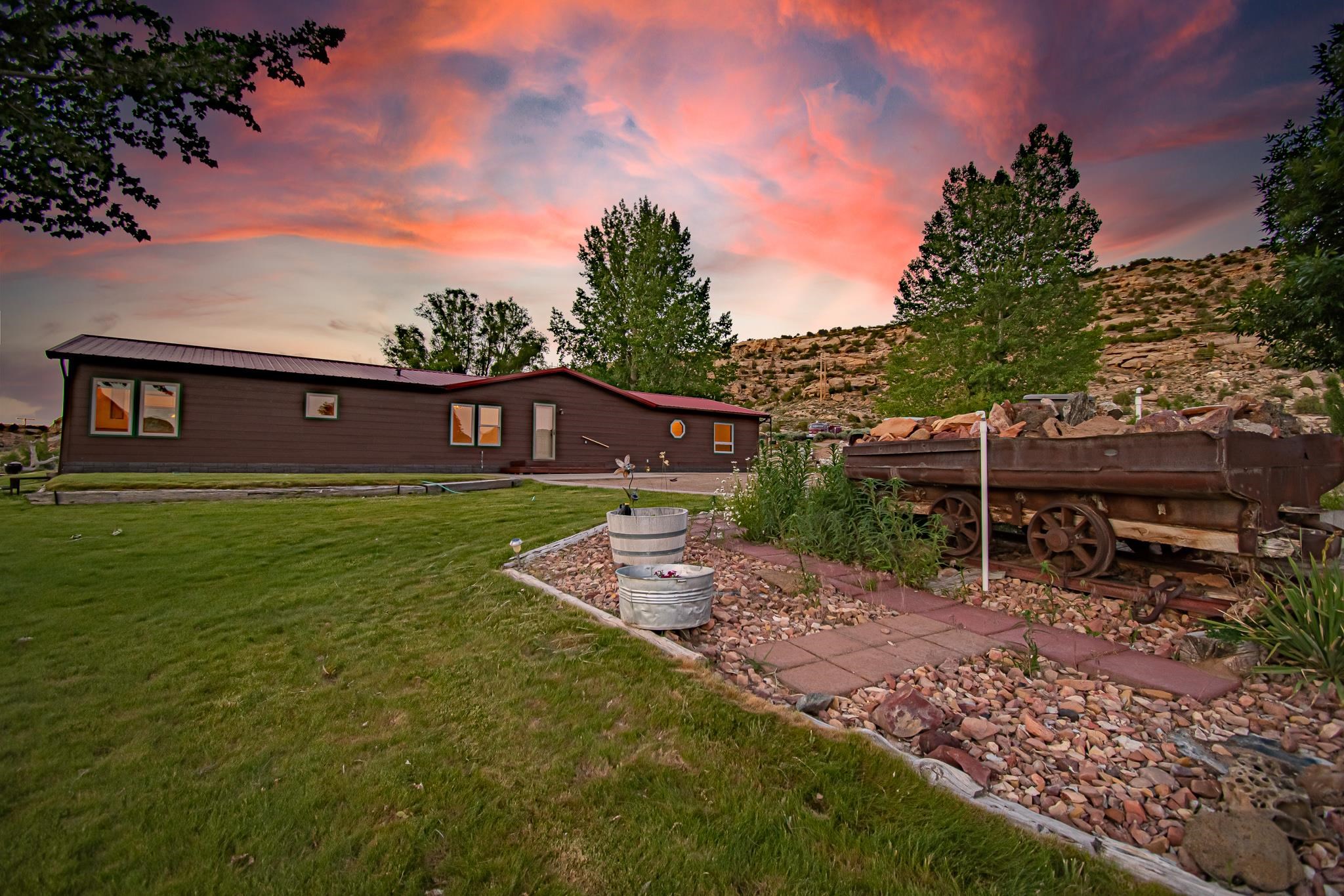 24591 Highway 64 Rangely, CO 81648 - Photo 2 of 42 a view of house with backyard
