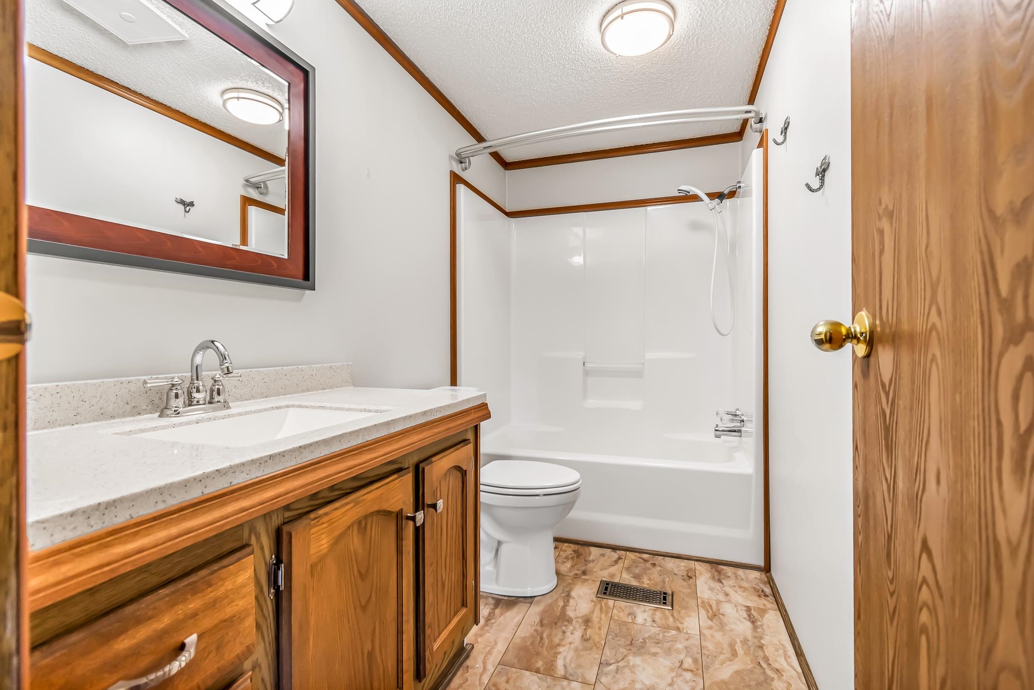 24591 Highway 64 Rangely, CO 81648 - Photo 27 of 42 a bathroom with a granite countertop sink toilet and shower