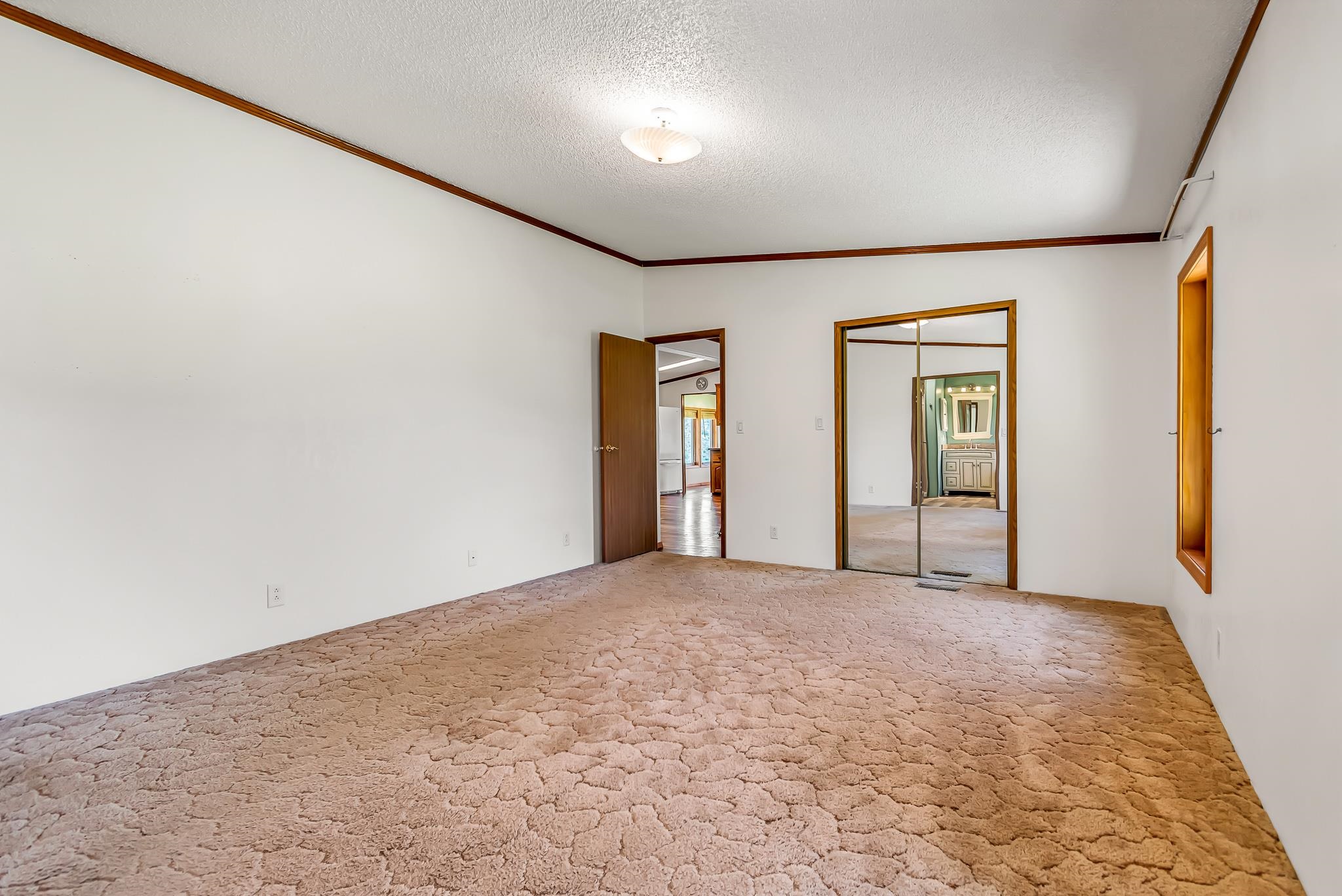 24591 Highway 64 Rangely, CO 81648 - Photo 28 of 42 an empty room with windows and closet