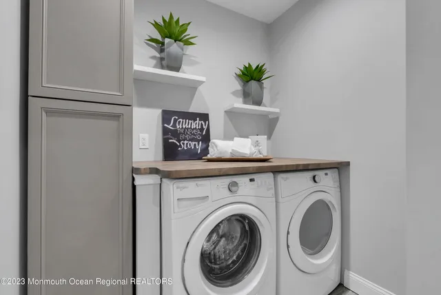 a view of livingroom with washer and dryer