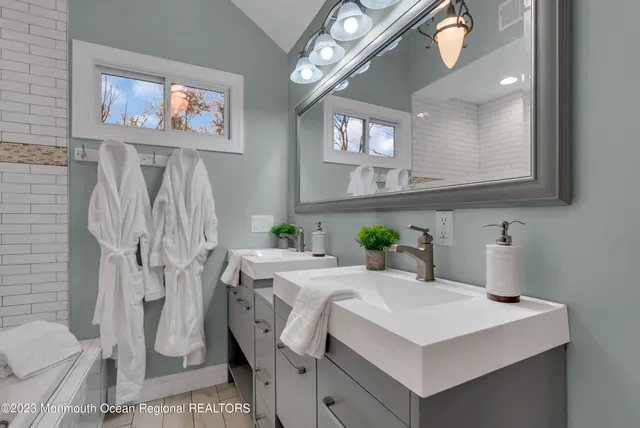 a view of a kitchen area with furniture and wooden floor