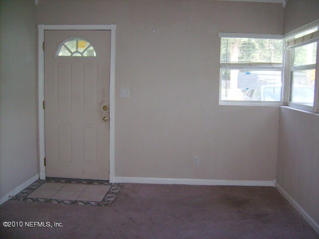 2839 Kline Road Jacksonville, FL 32246 - Photo 3 of 17 an empty room with windows