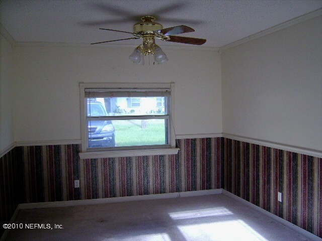 2839 Kline Road Jacksonville, FL 32246 - Photo 6 of 17 a view of a hallway with wooden floor