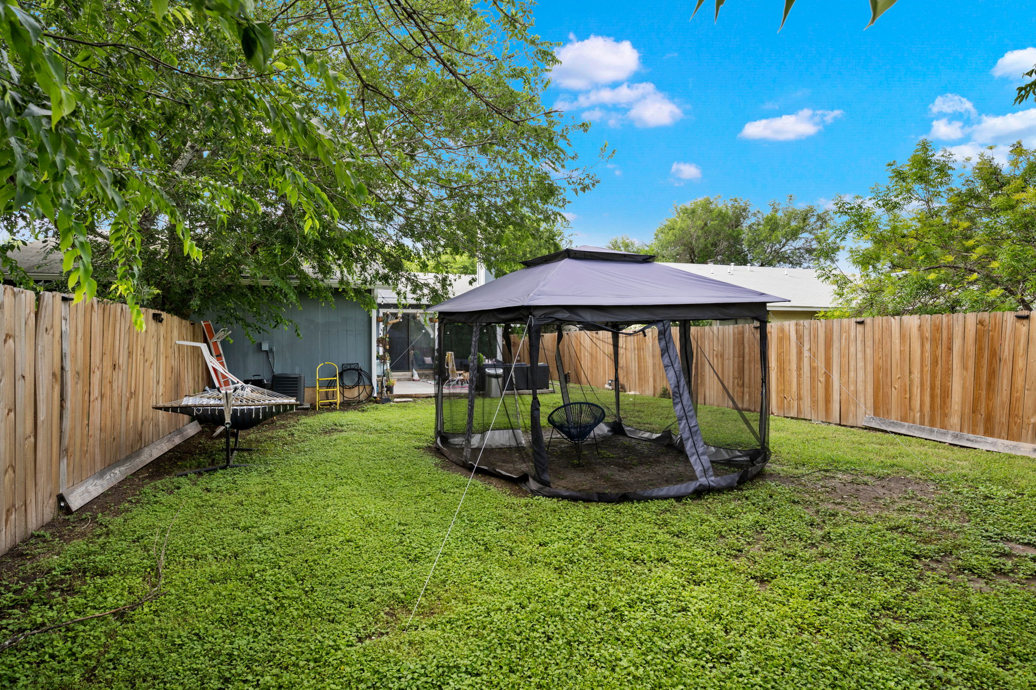 8317 Forest Ridge Drive San Antonio, TX 78239 - Photo 22 of 26 A fully fenced backyard offers a private outdoor retreat, ideal for relaxation.