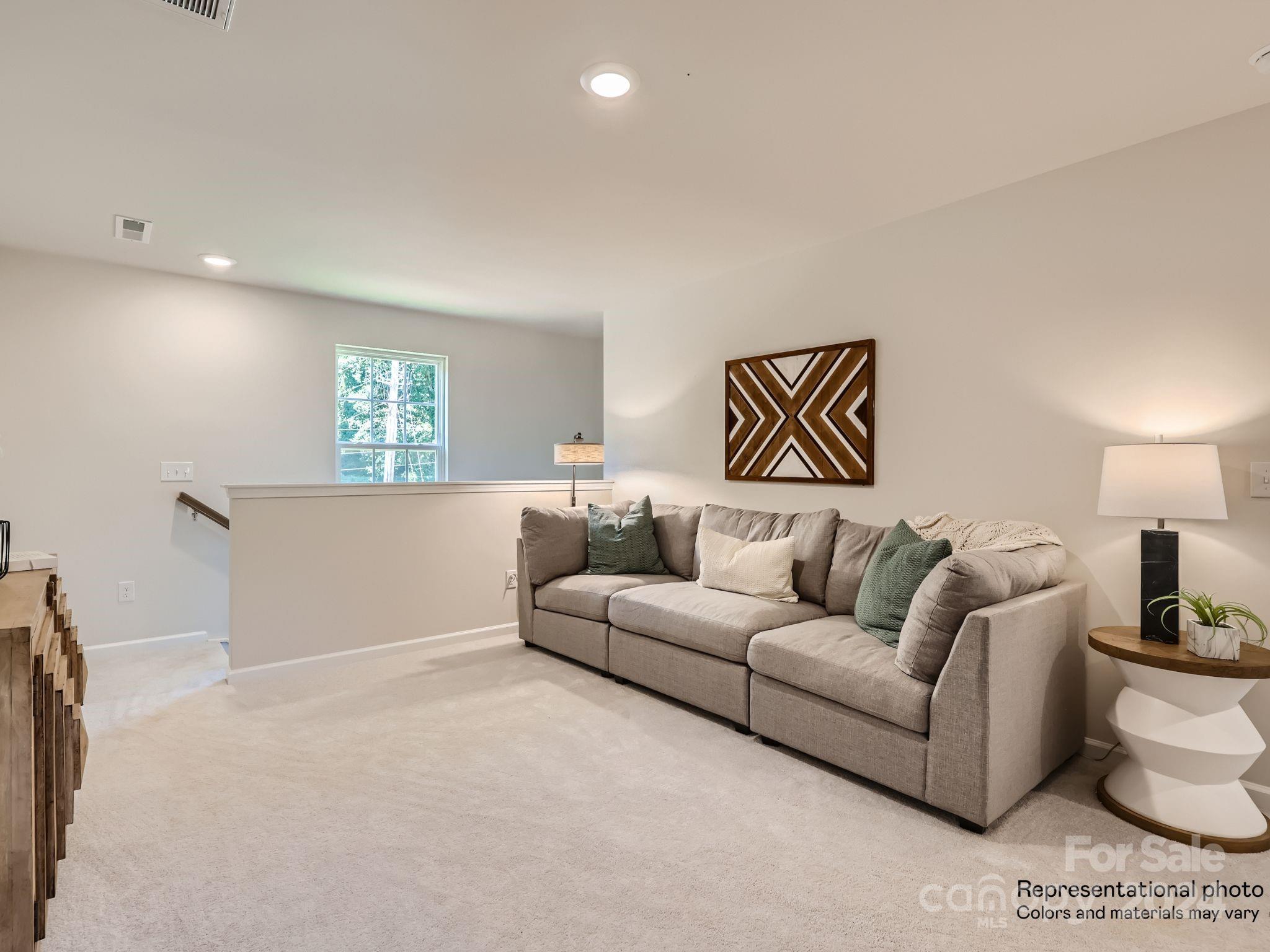15237 Windy Plns Road Charlotte, NC 28262 - Photo 12 of 24 a living room with furniture and a couch