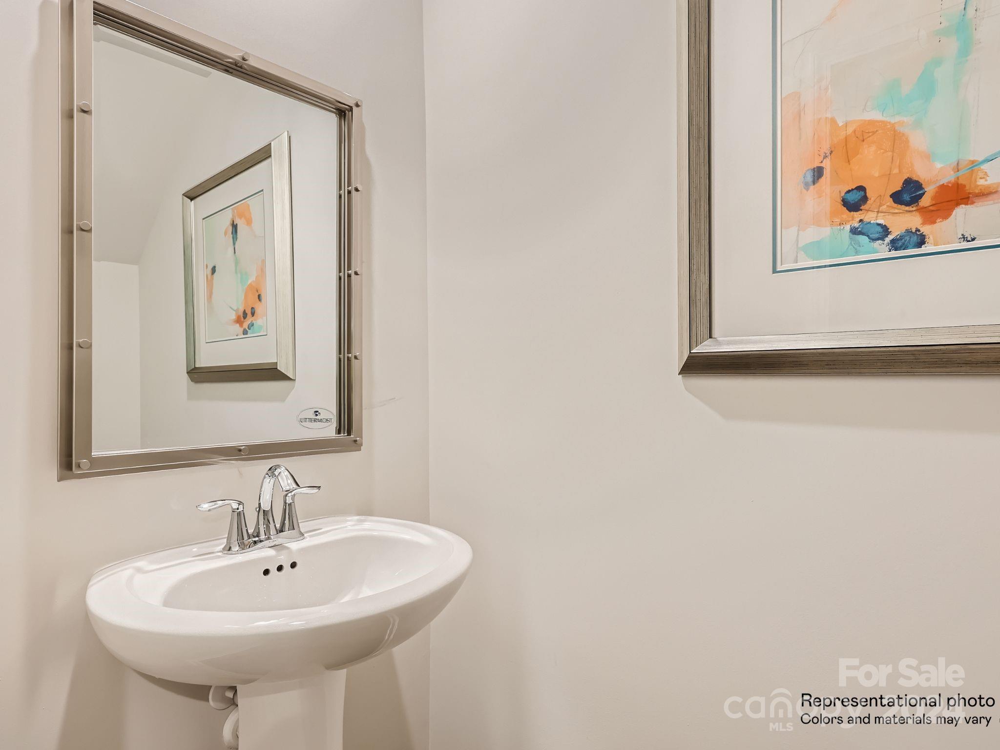 15237 Windy Plns Road Charlotte, NC 28262 - Photo 24 of 24 a bathroom with a sink and a mirror