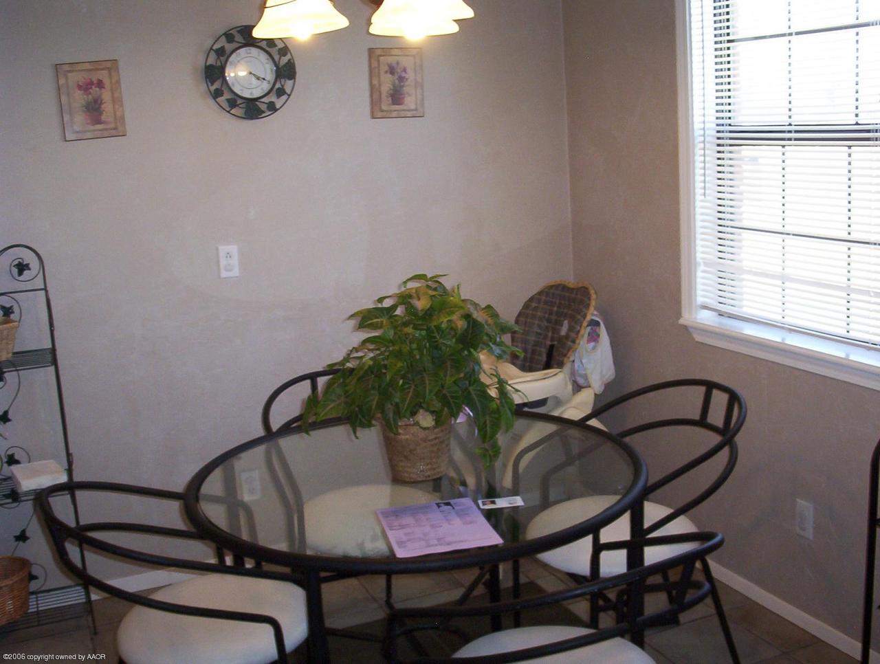 4207 Camp Lane Amarillo, TX 79110 - Photo 5 of 11 a dining room with furniture and window