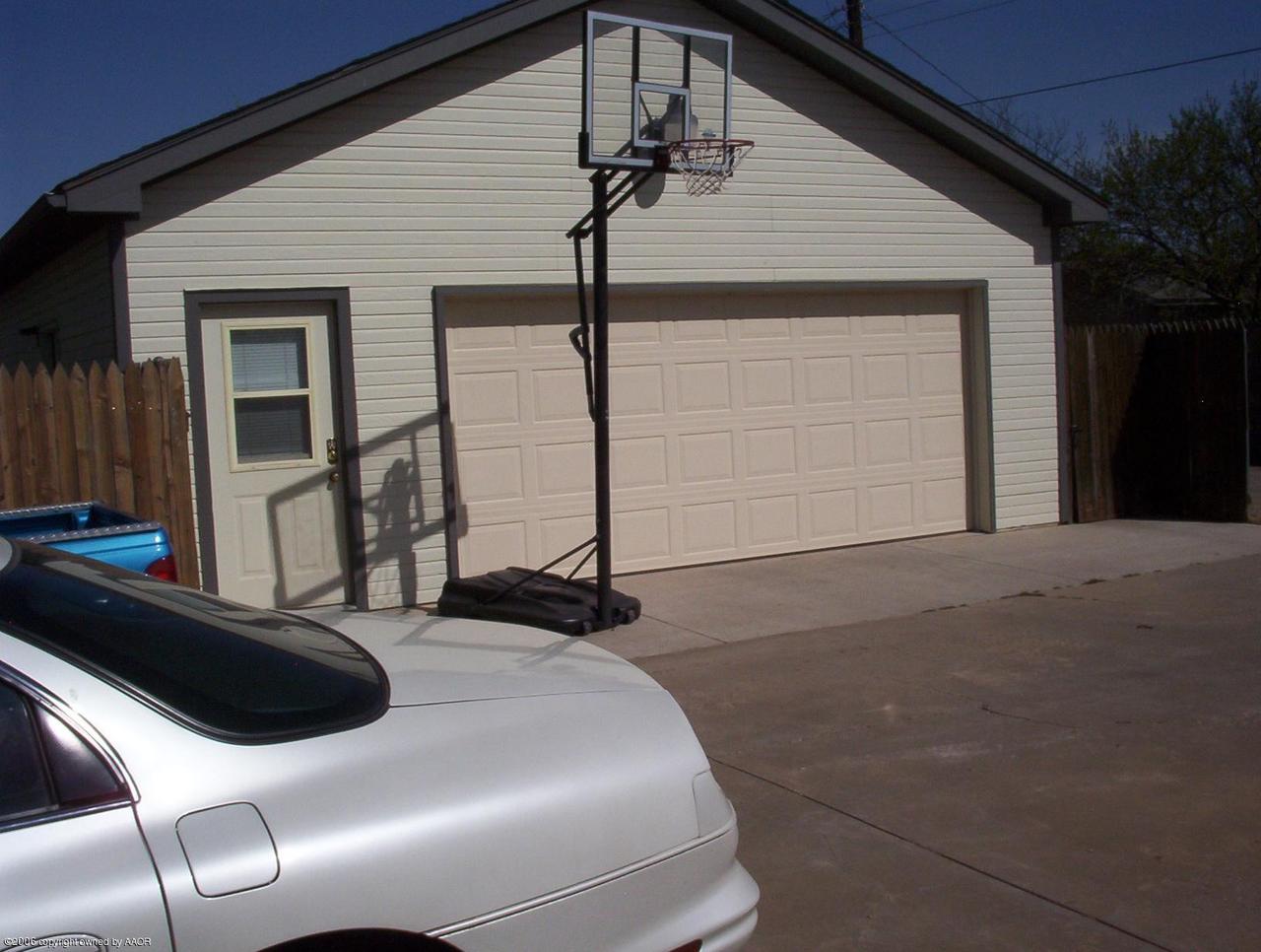 4207 Camp Lane Amarillo, TX 79110 - Photo 10 of 11 a front view of a house with a garage