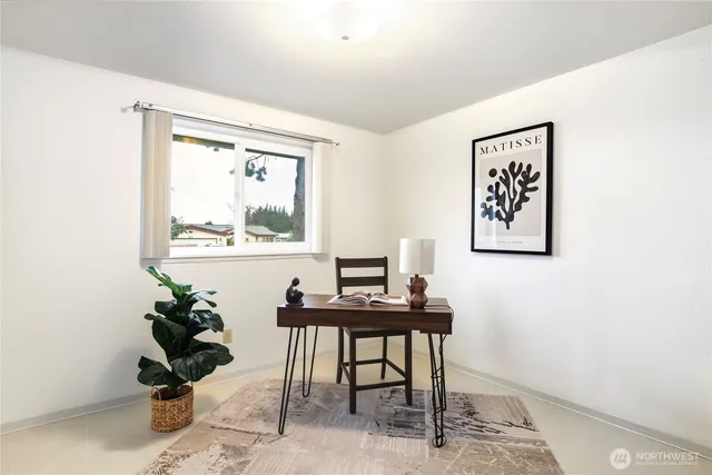 a view of a workspace with furniture