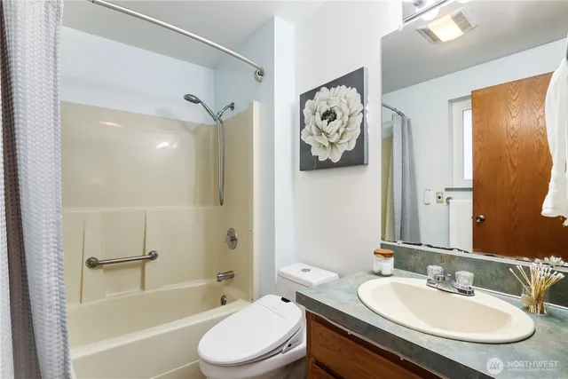 a bathroom with a sink a toilet and a bathtub