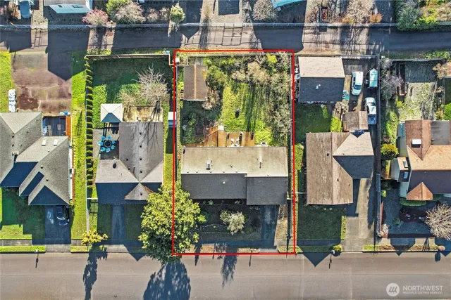 an aerial view of residential houses with outdoor space