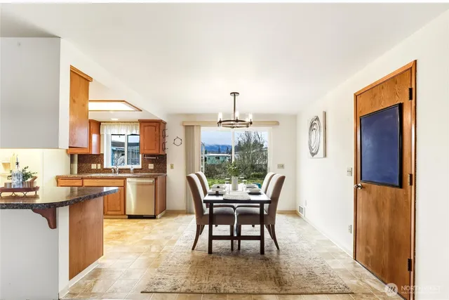 a dining room with furniture and window