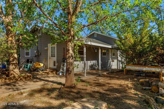 a front view of a house with sitting area