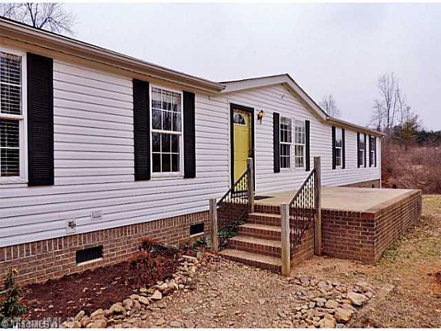 743 Lazy Branch Road Ennice, NC 28623 - Photo 1 of 16 Exterior Front. Welcome to your spacious home, newly renovated and on 3.84 acres!