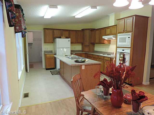 743 Lazy Branch Road Ennice, NC 28623 - Photo 2 of 16 Keeping Room. The kitchen is convenient next to the mudroom and pantry. Kick off your wet shoes and coats here! Also easy access for bringing in groceries and storing them in the huge pantry off the mudroom!