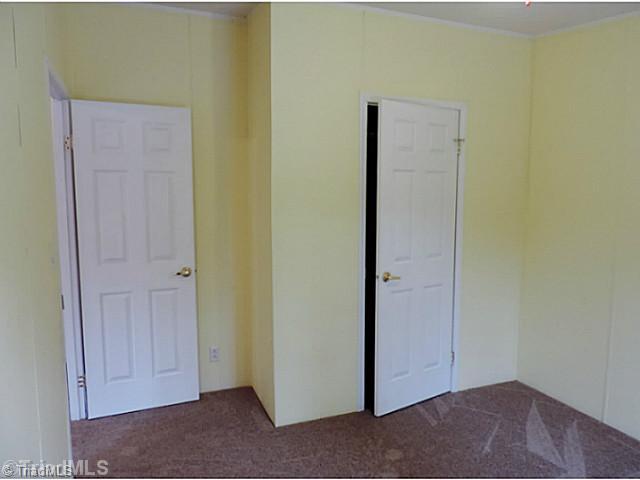 743 Lazy Branch Road Ennice, NC 28623 - Photo 12 of 16 2nd Bedroom. This bedroom is on the back of the house and affords the most quiet and privacy.