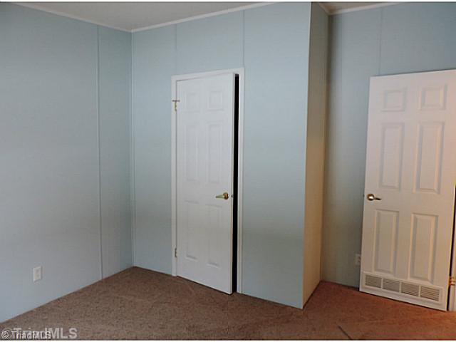743 Lazy Branch Road Ennice, NC 28623 - Photo 13 of 16 3rd Bedroom. Faces south with lots of natural light!