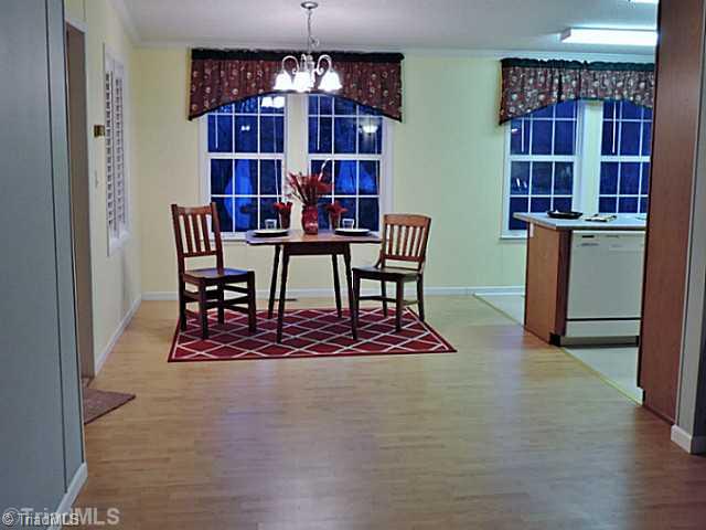 743 Lazy Branch Road Ennice, NC 28623 - Photo 3 of 16 Keeping Room. Wonderful open space will easily accommodate a large table with chairs!