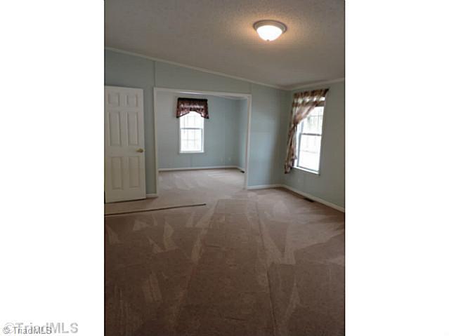 743 Lazy Branch Road Ennice, NC 28623 - Photo 4 of 16 Master Bedroom. Expansive master bedroom with your own private sitting area 11 perfect for suggling up with a good book!