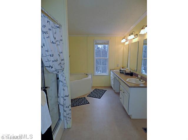 743 Lazy Branch Road Ennice, NC 28623 - Photo 5 of 16 Master Bath/Spa. Your private spa with full shower, two-sink vanity & built in dressing table, and soaking tub!