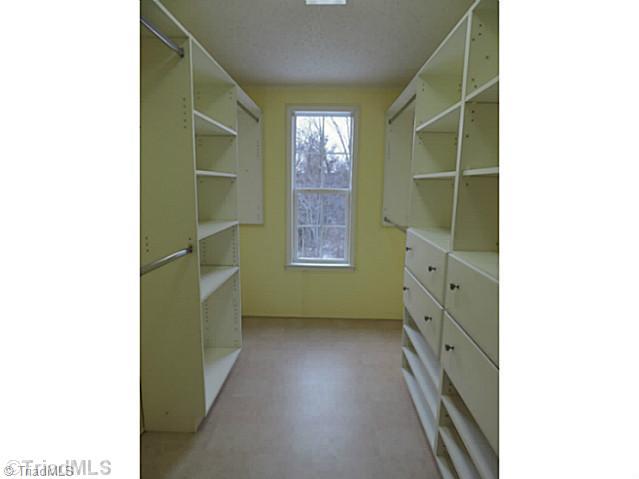 743 Lazy Branch Road Ennice, NC 28623 - Photo 6 of 16 Master Bath/Spa. Customizable shelving, drawers and hanging space make this the closet "to-die-for!"