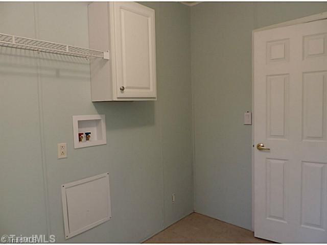 743 Lazy Branch Road Ennice, NC 28623 - Photo 7 of 16 Laundry Room. This room is accessible from the back door, making it an excellent mudroom. The door to the right is to a huge walk-in pantry -- amazing storage in this home!