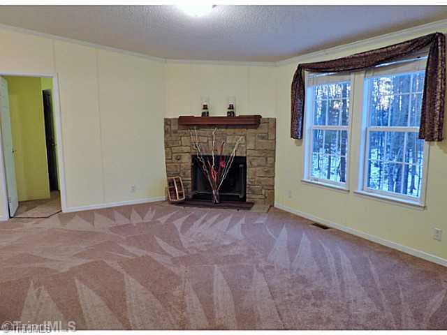 743 Lazy Branch Road Ennice, NC 28623 - Photo 10 of 16 Den/Family/Great Room. Imagine your family and friends enjoying a fire in this comfortable space!