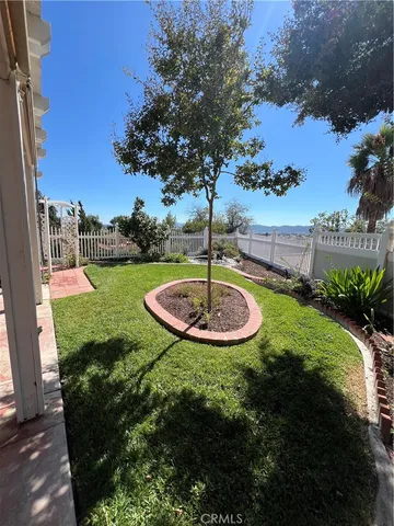 a view of a swimming pool with a yard