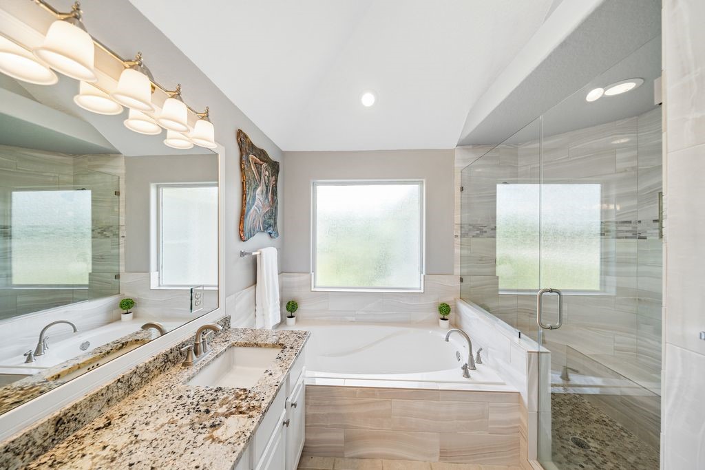 1607 Schooner Point Willis, TX 77318 - Photo 24 of 47 Relax in the large soaking tub or the XL walk in shower with double head faucets.