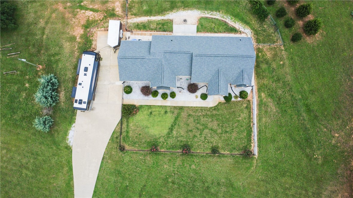 2900 Highway 187 Anderson, SC 29626 - Photo 38 of 41 An aerial perspective reveals a well-maintained property with a concrete driveway, established landscaping, and abundant green space.