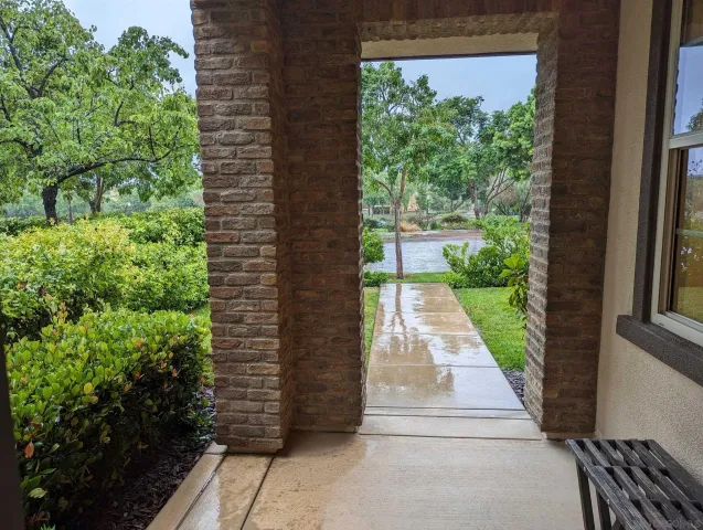 a view of a pathway with a yard