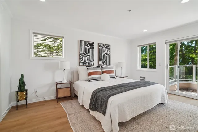 a bedroom with a large bed and a window