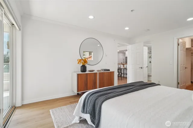 a bed room with a bed and a painting