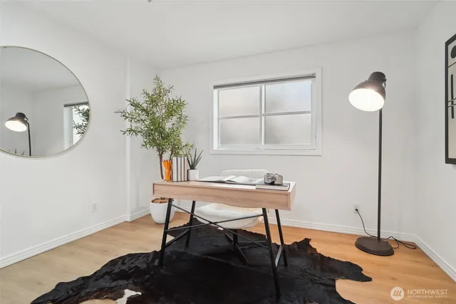 a workspace with furniture and wooden floor