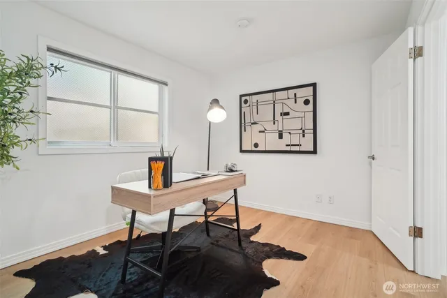 a workspace with furniture and window