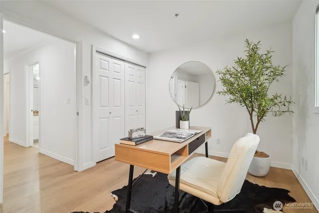 a workspace with furniture and wooden floor