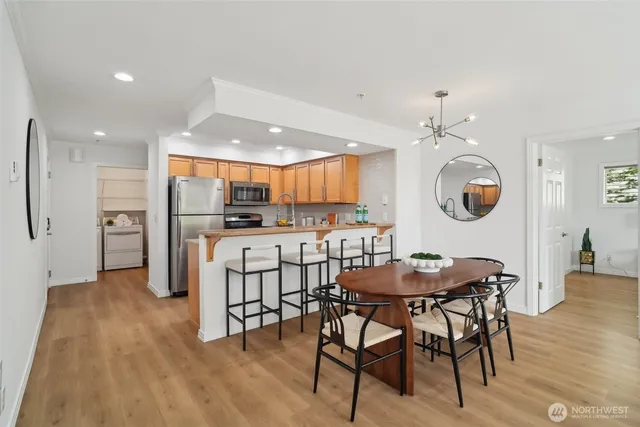 a view of a dining room with furniture and wooden floor