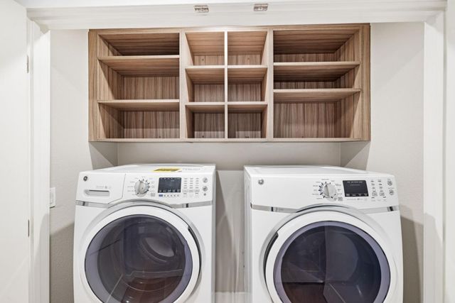 a bathroom with a toilet a sink a mirror and vanity