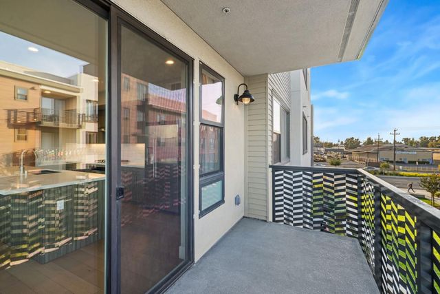 a view of a hallway with stairs
