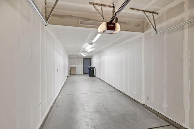 a front view of a building with lot of cars parked