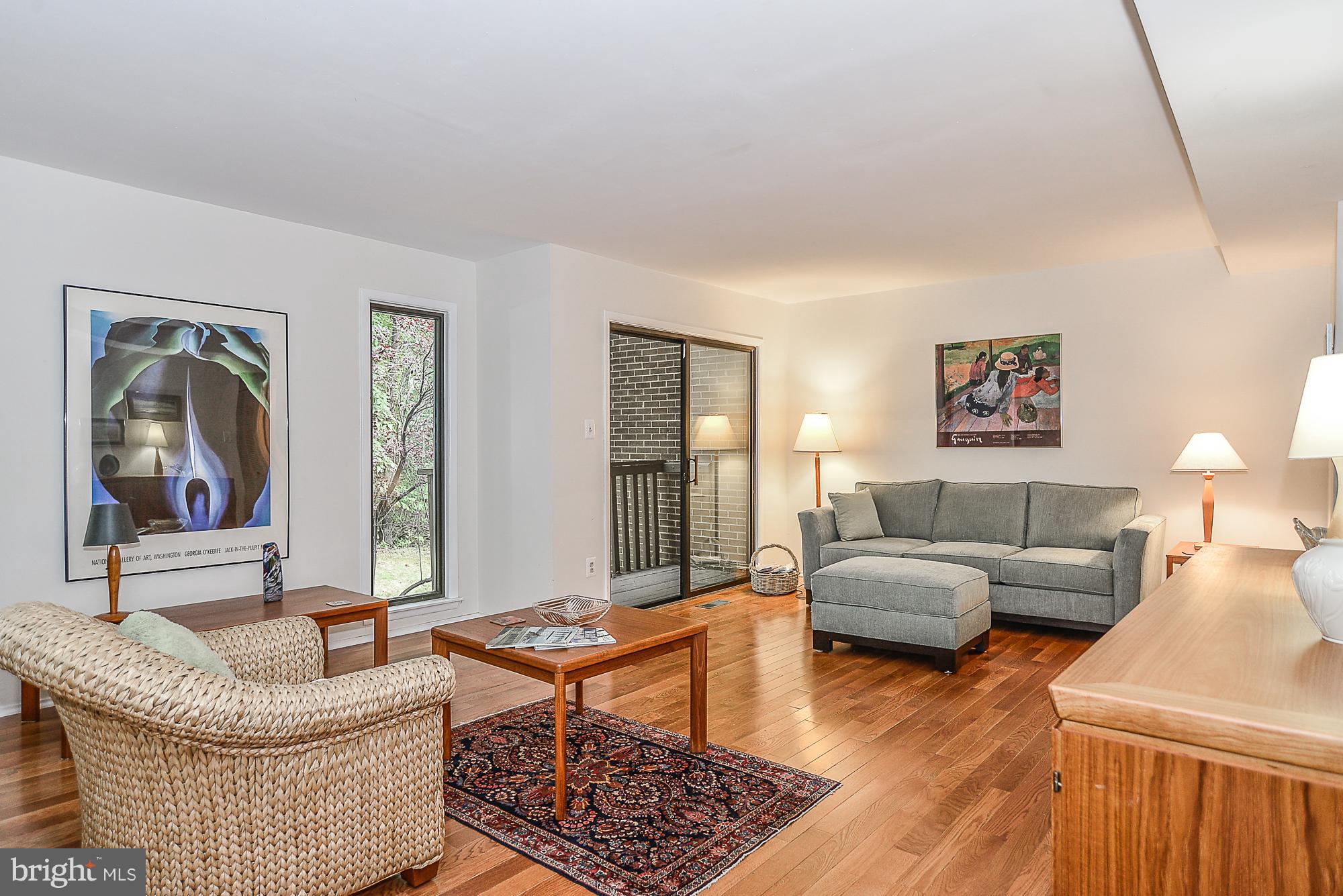 2001 Winged Foot Court Reston, VA 20191 - Photo 4 of 30 Living Room with New Hardwood Floors to Balcony