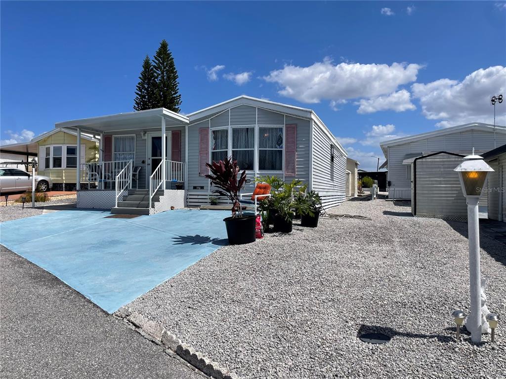 251 Patterson Road, Unit C31 Haines City, FL 33844 - Photo 1 of 16 a front view of a house with patio