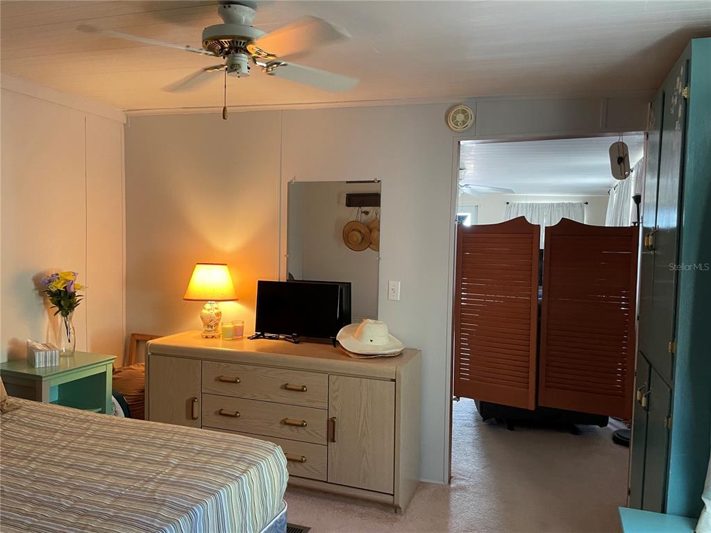 251 Patterson Road, Unit C31 Haines City, FL 33844 - Photo 13 of 16 a bedroom with a bed and a dresser