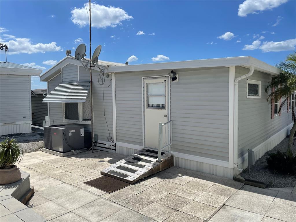 251 Patterson Road, Unit C31 Haines City, FL 33844 - Photo 3 of 16 a front view of a house with entryway