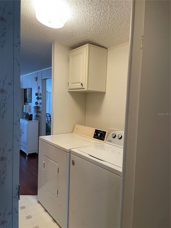 251 Patterson Road, Unit C31 Haines City, FL 33844 - Photo 6 of 16 a utility room with dryer and washer