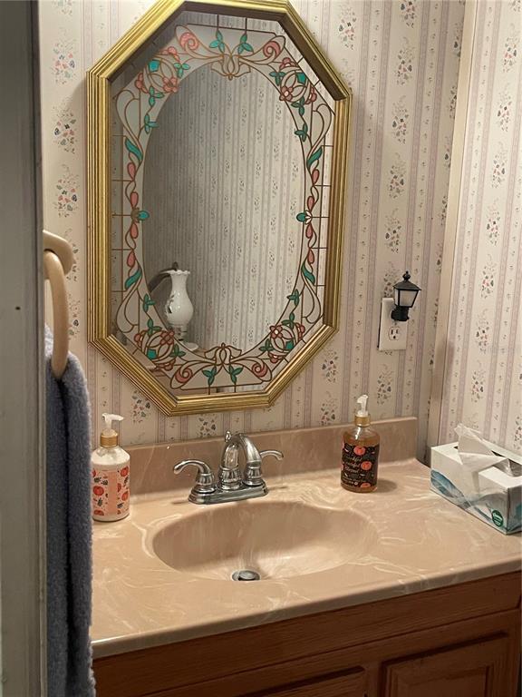 251 Patterson Road, Unit C31 Haines City, FL 33844 - Photo 7 of 16 a bathroom with a sink and mirror