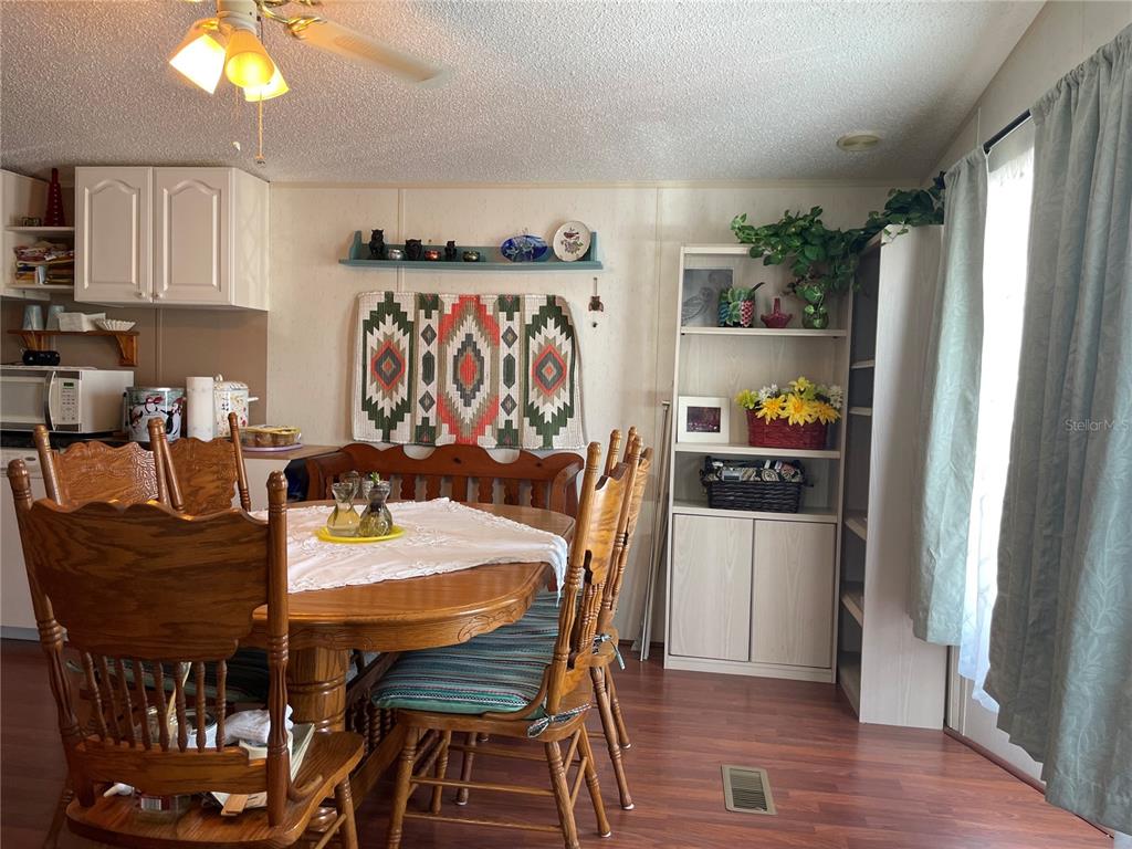 251 Patterson Road, Unit C31 Haines City, FL 33844 - Photo 9 of 16 a kitchen with stainless steel appliances granite countertop a refrigerator and a stove top oven